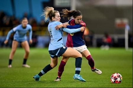 Manchester City's English striker #11 Lauren Hemp vies for the ball with Barcelona's Spanish midfielder Aitana Bonmati during the UEFA Women's Champions League Group D football match between Manchester City and Barcelona at the Joie Stadium in Manchester on October 9, 2024. (Photo by Paul ELLIS / AFP)